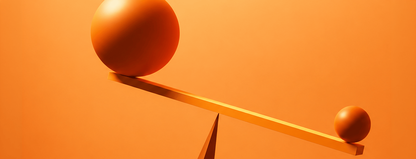 A large orange sphere and a small orange sphere balanced on opposite ends of a tilted beam
